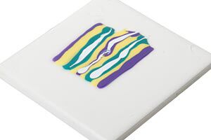 Streaks of wet polyclay on a ceramic tile